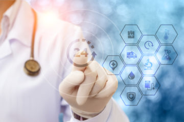 Doctor pressing a button that says "24" signifying a patient portal offering 24 hour availability.