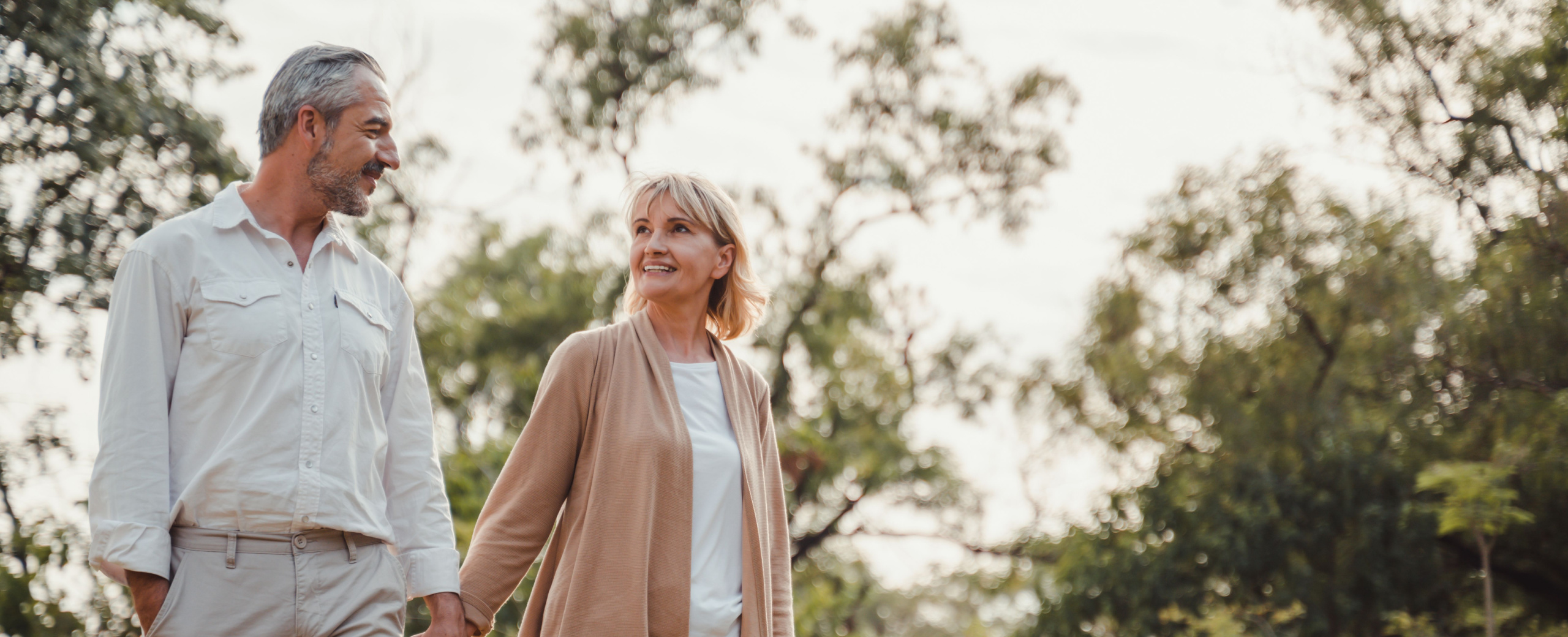 man and woman holding hands.